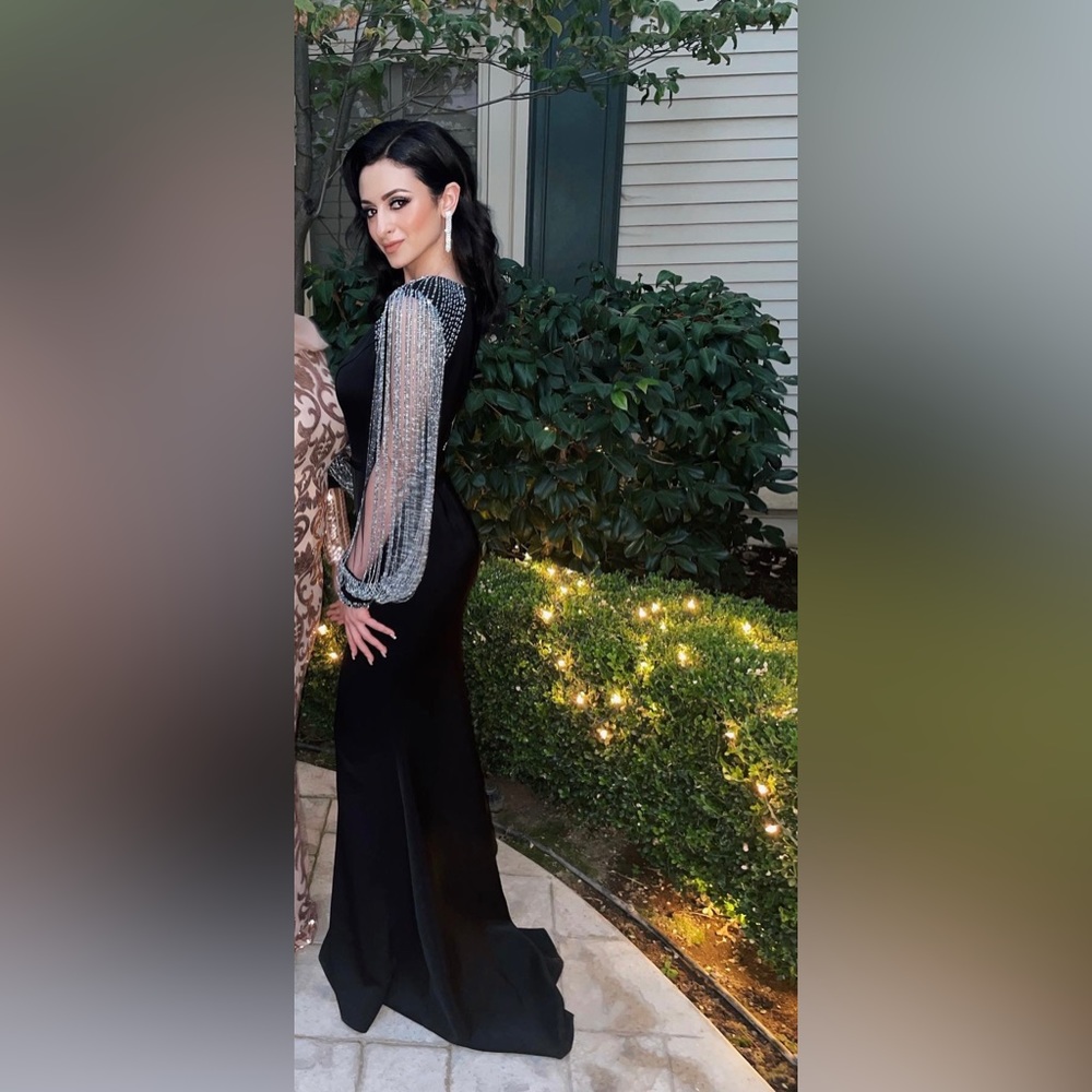 Beaded tassel sleeve trumpet gown designed by Mac Duggal